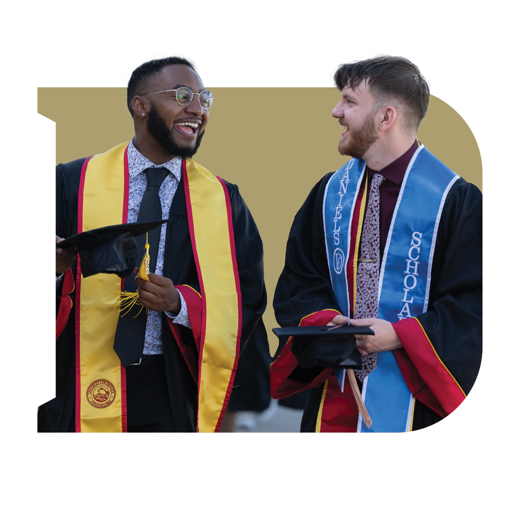 Two graduates smiling