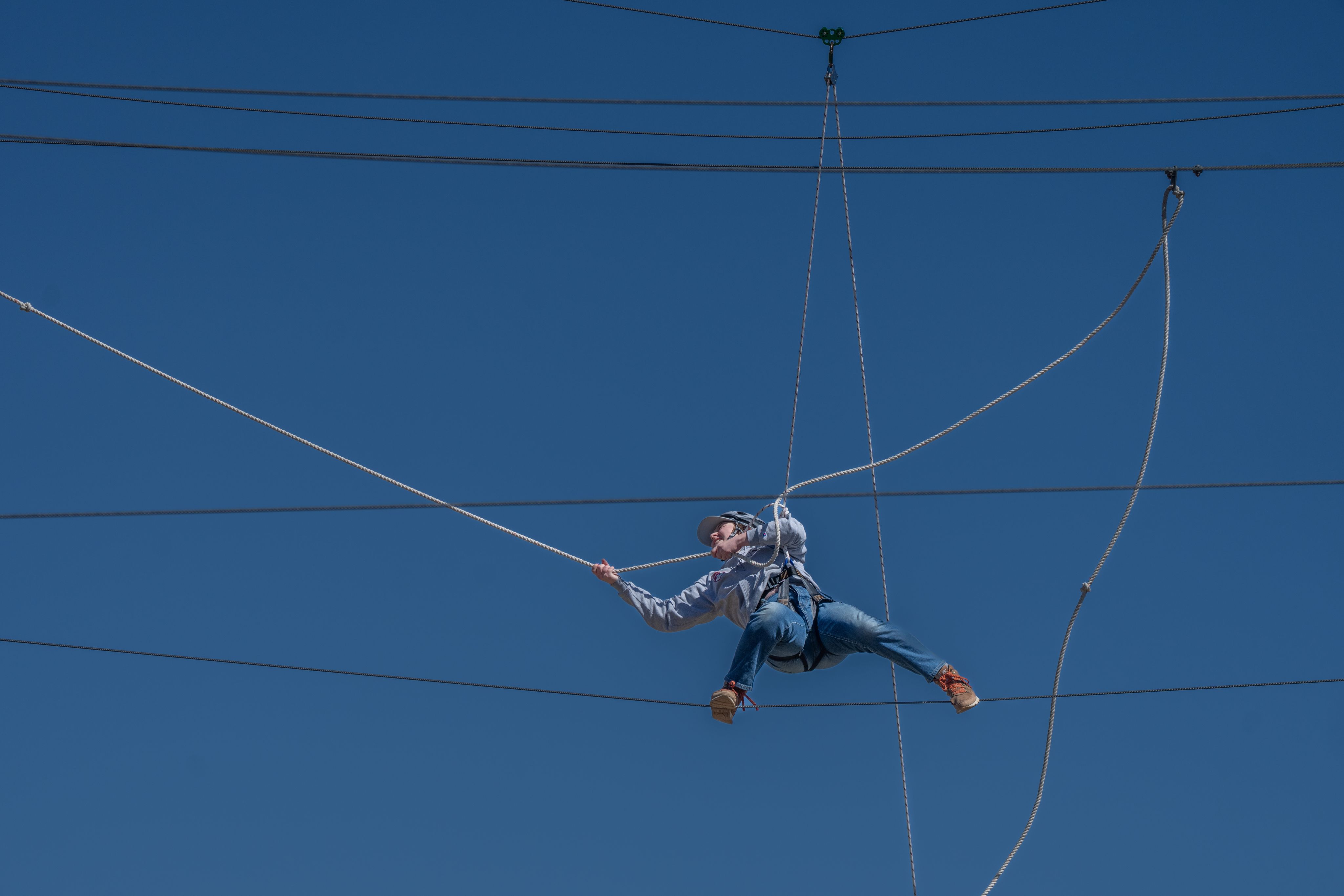 Student on the ropes course at Kennedy Mountain Campus