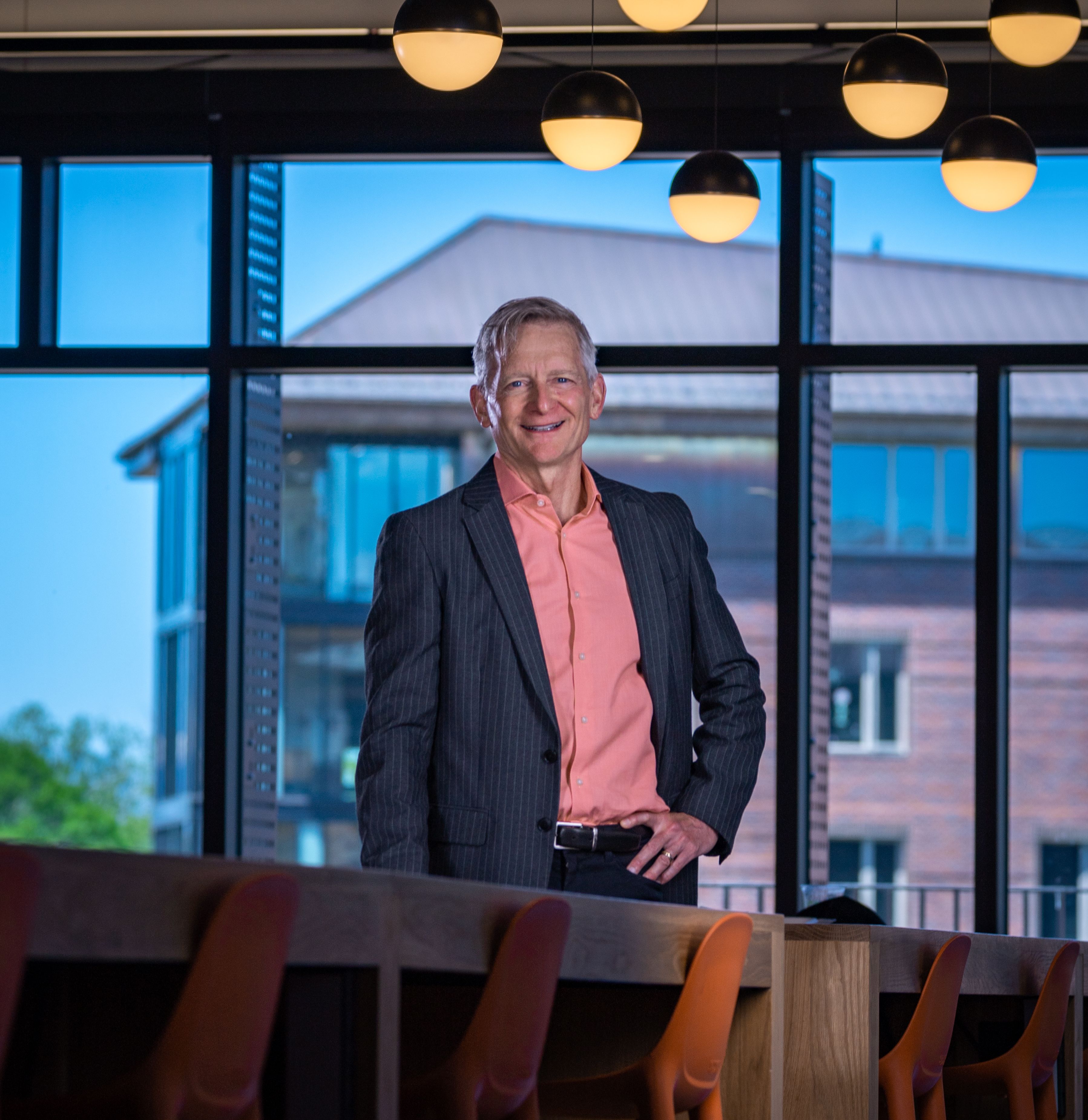 Chancellor Haefner standing and smiling