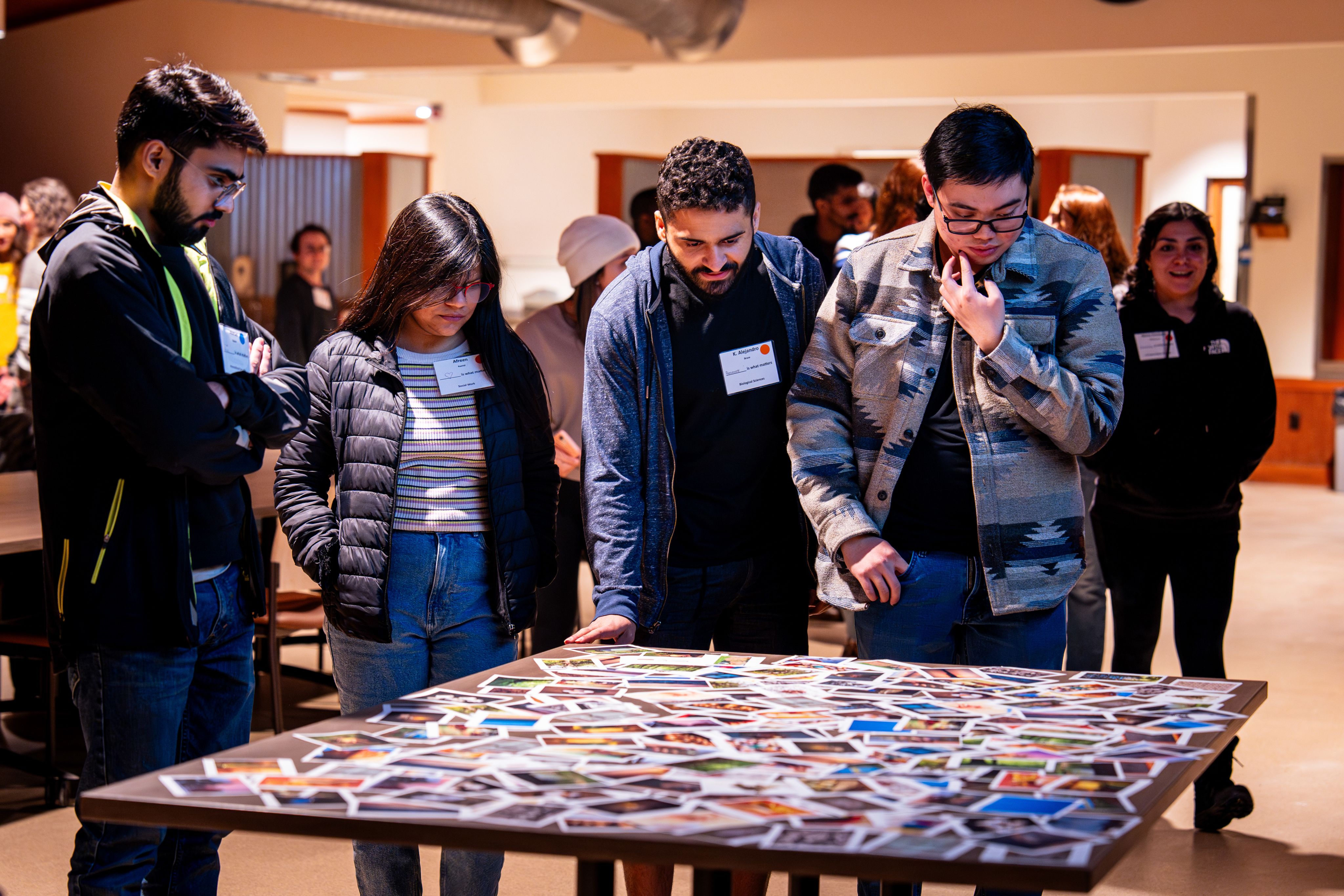 Students looking at photos on a table