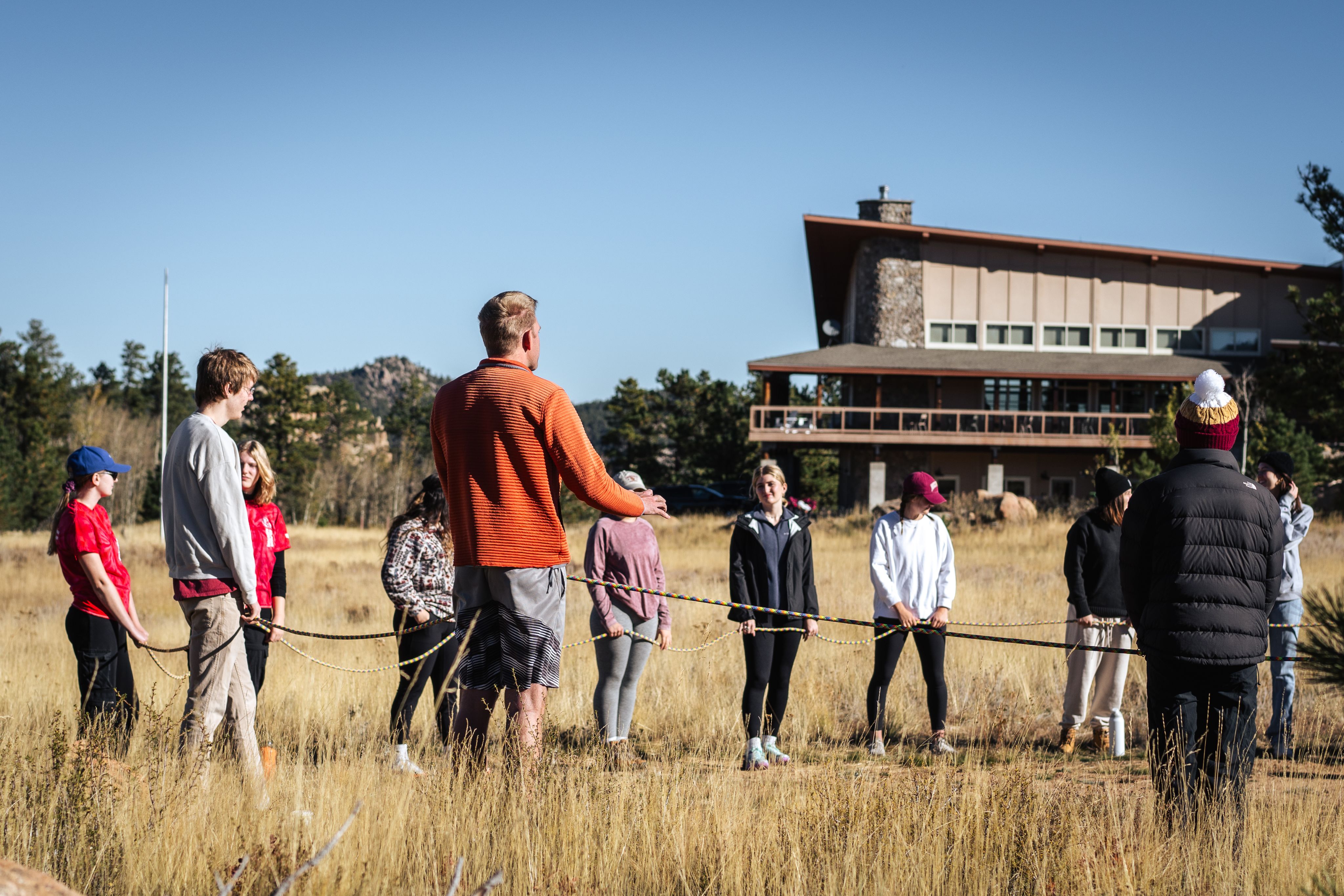 Students standing in a circle at the Kennedy Mountain Campus