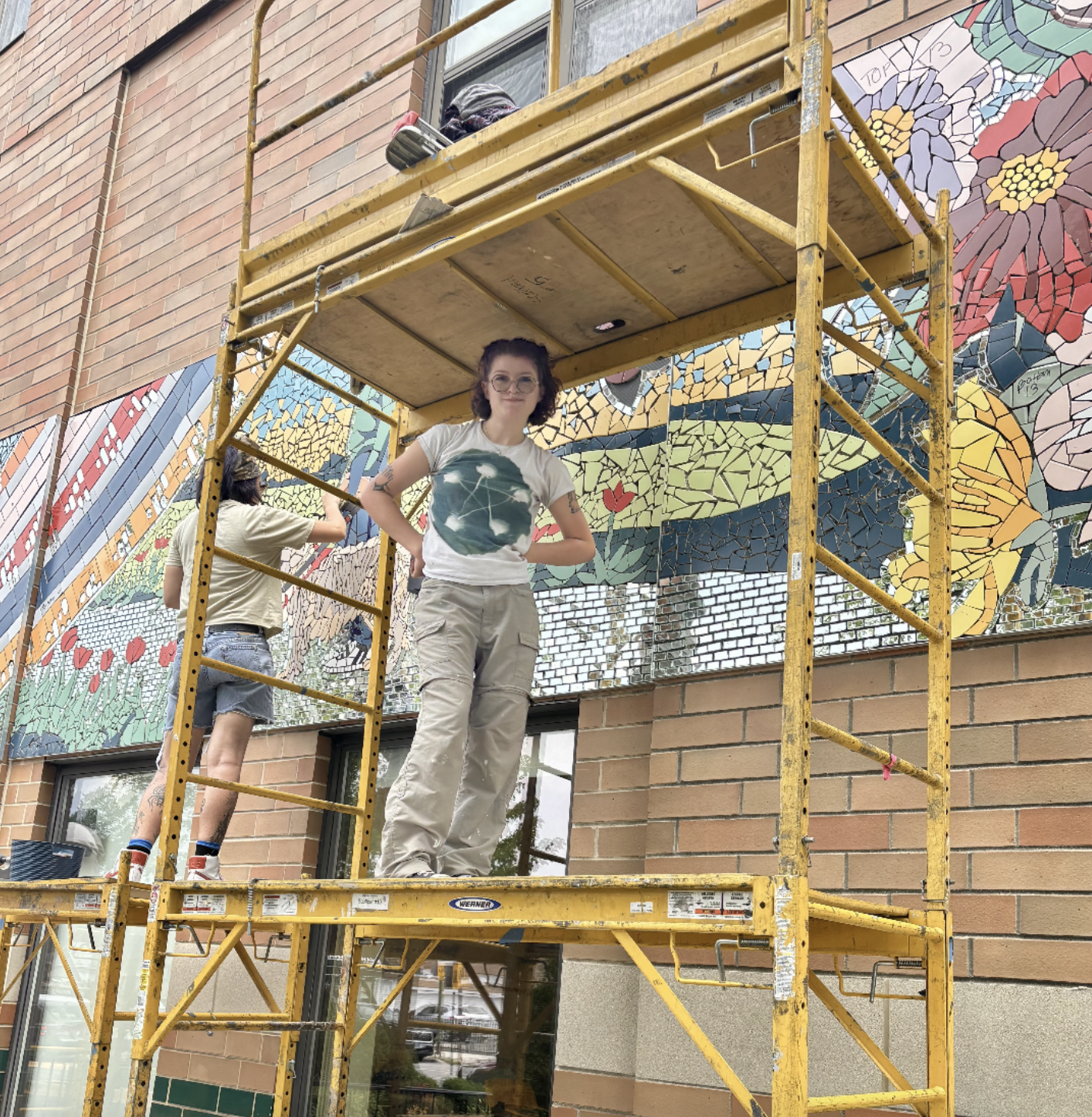 Genevieve Desch standing in scaffolding