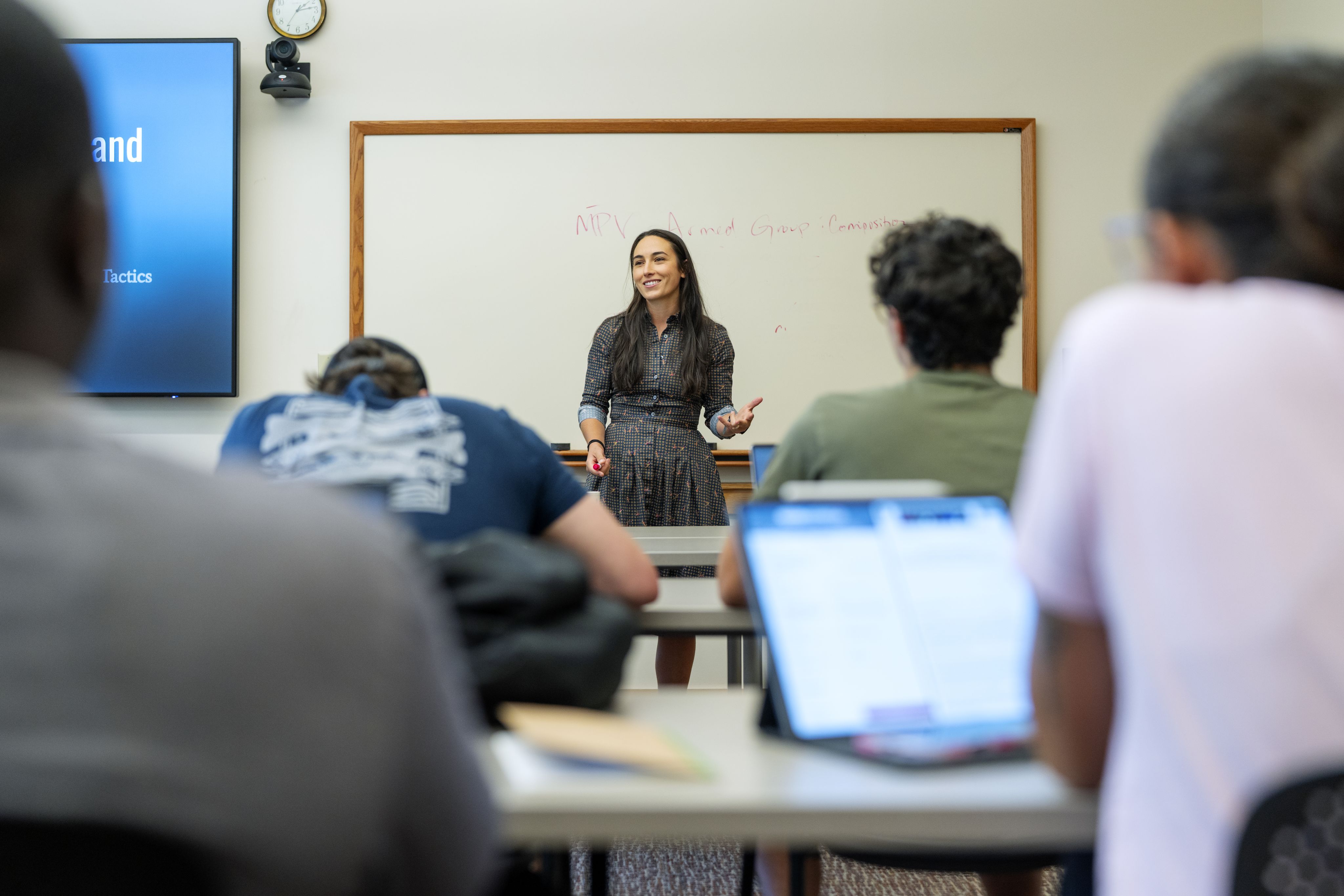A professor addressing students.