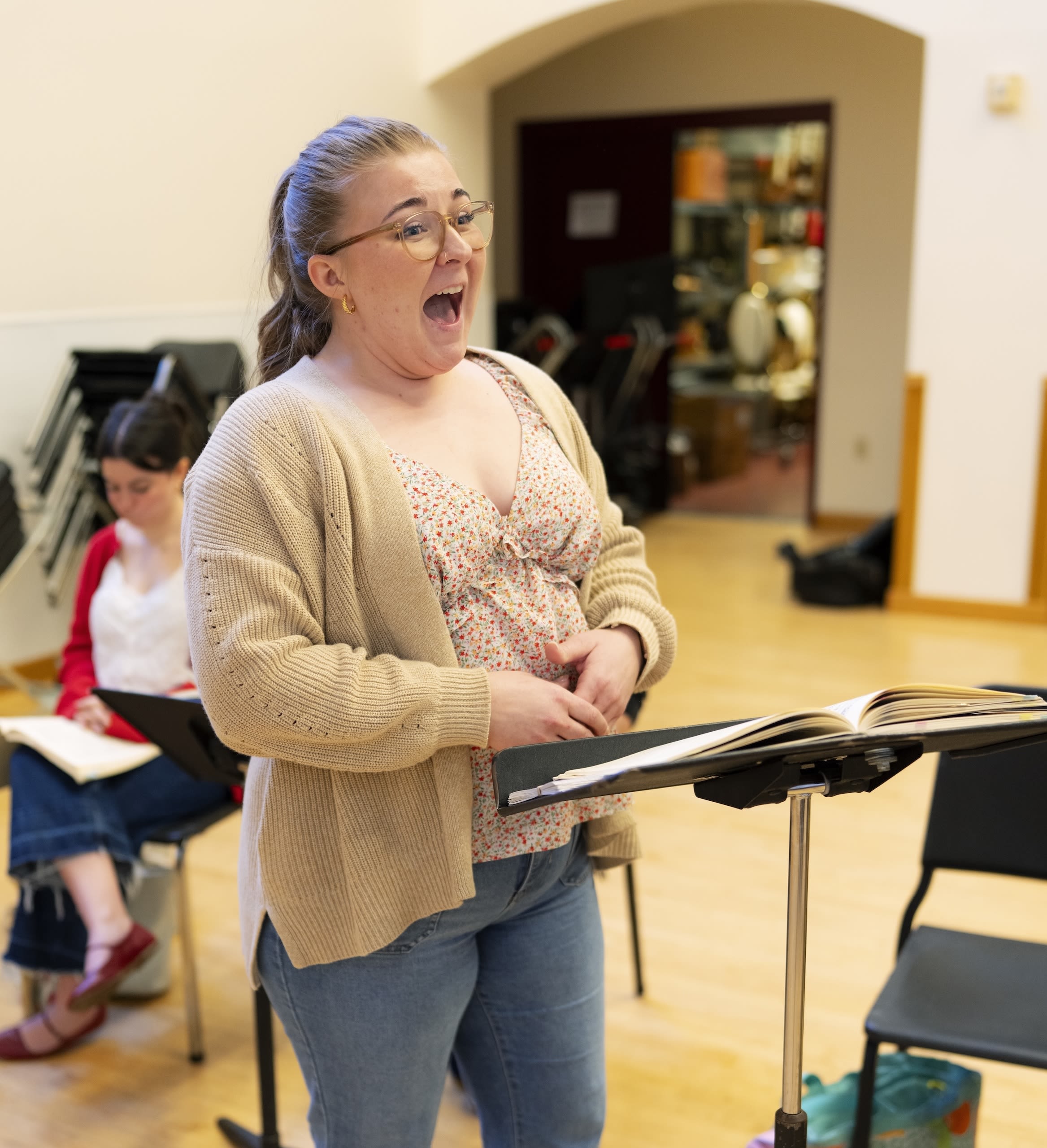 a person singing in a class