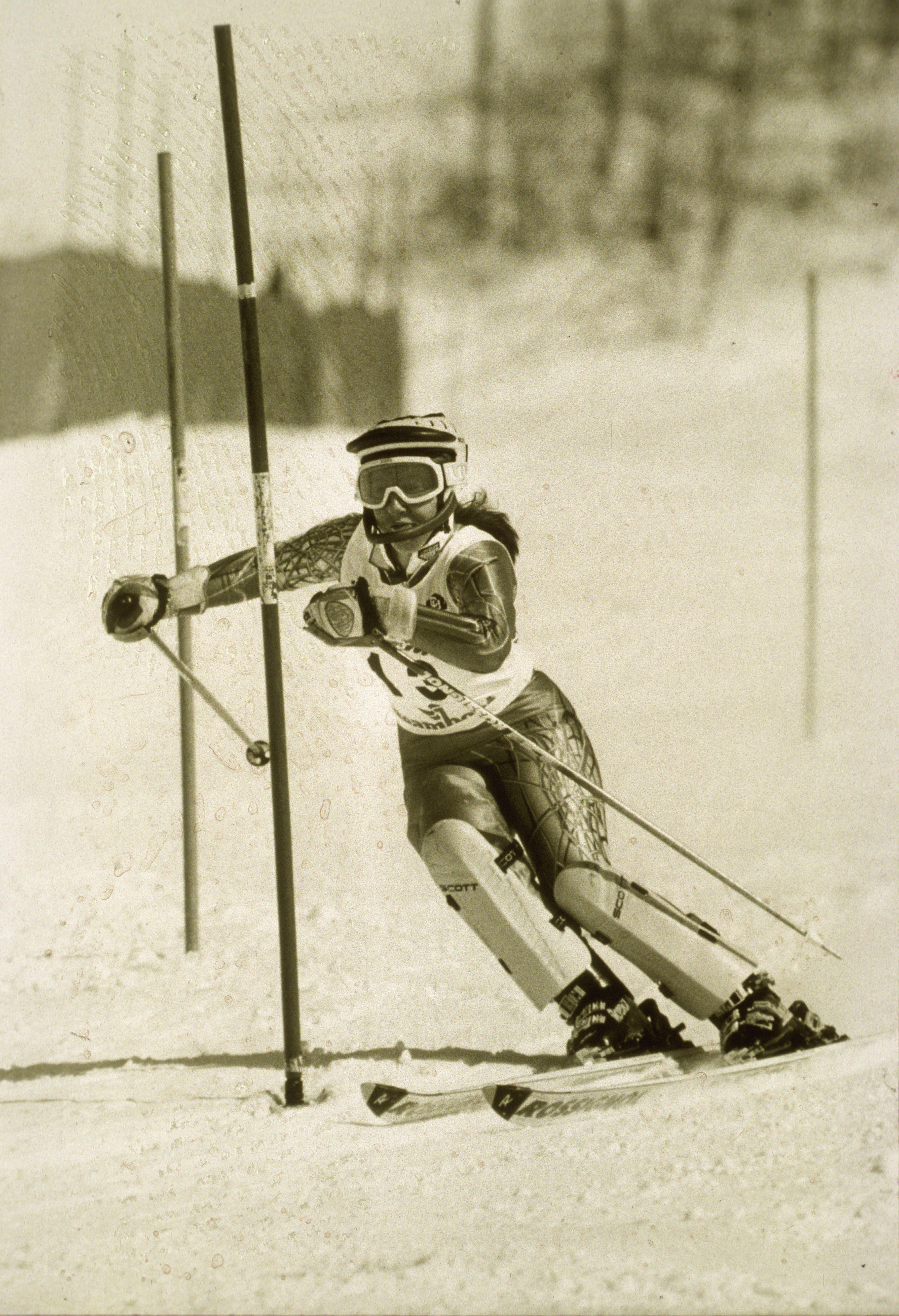 University of Denver (DU) Pioneers women's ski team member rounds a gate during a slalom race.