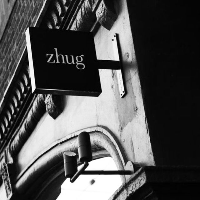 Zhug, one of alumnus Douglas Katz newest restaurants located in Cleveland Heights, Ohio. Black and white photo of zhug sign on the exterior of the restaurant