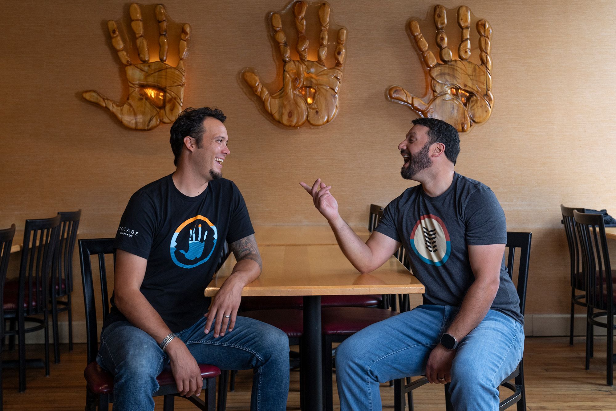 Ben Jacobs and Matt Chandra sit at a table in Tocabe.