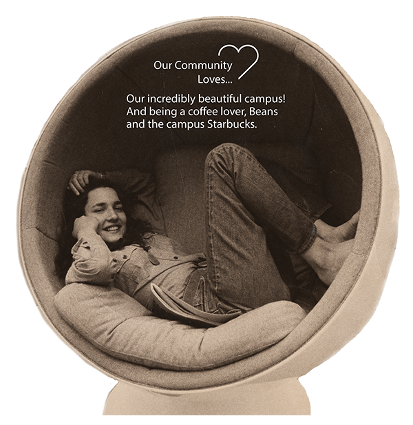 A female student reclines in a Herman Miller Egg Chair in Penrose Library on the University of Denver campus in Denver, Colorado.