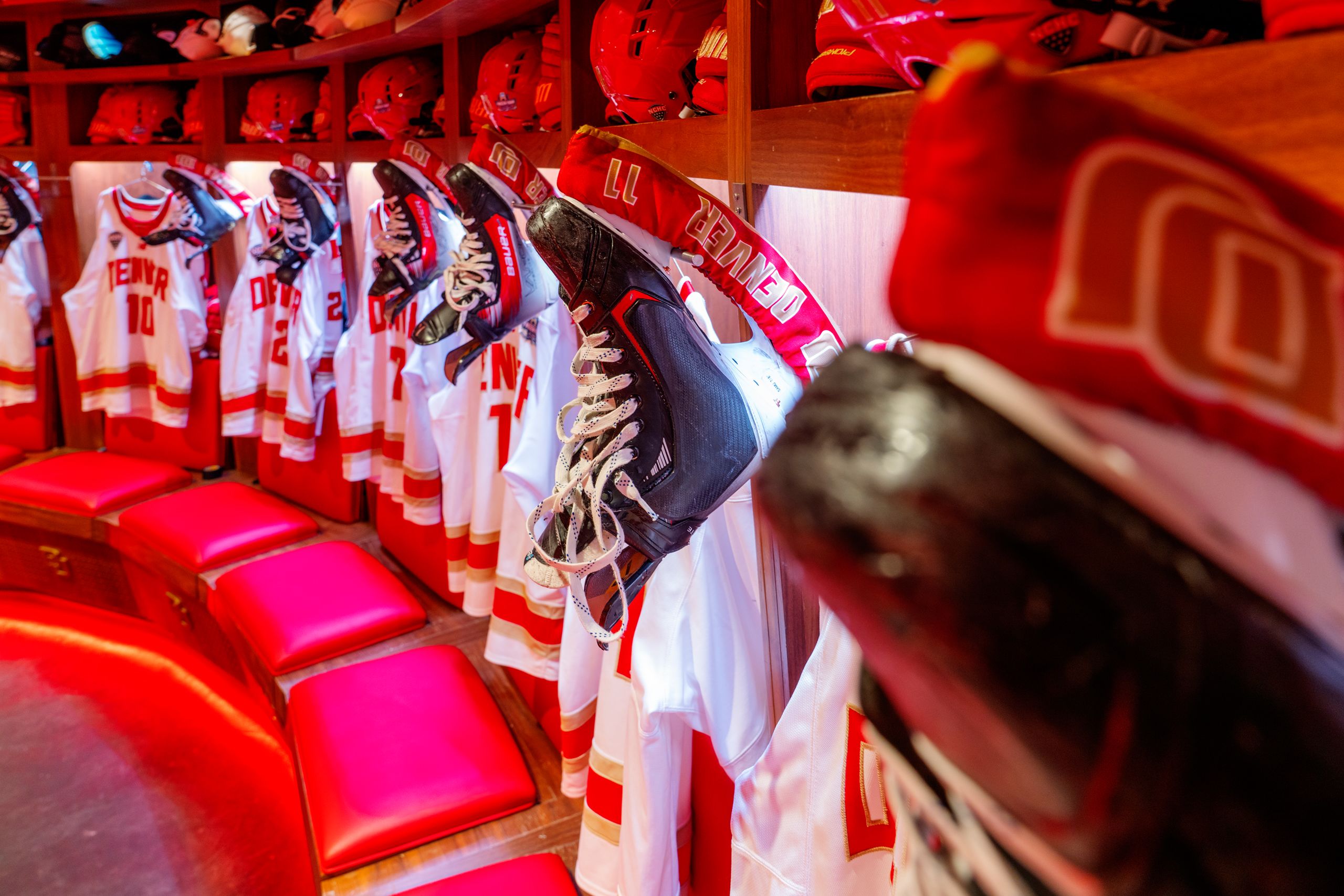 ice skates hanging in the locker room