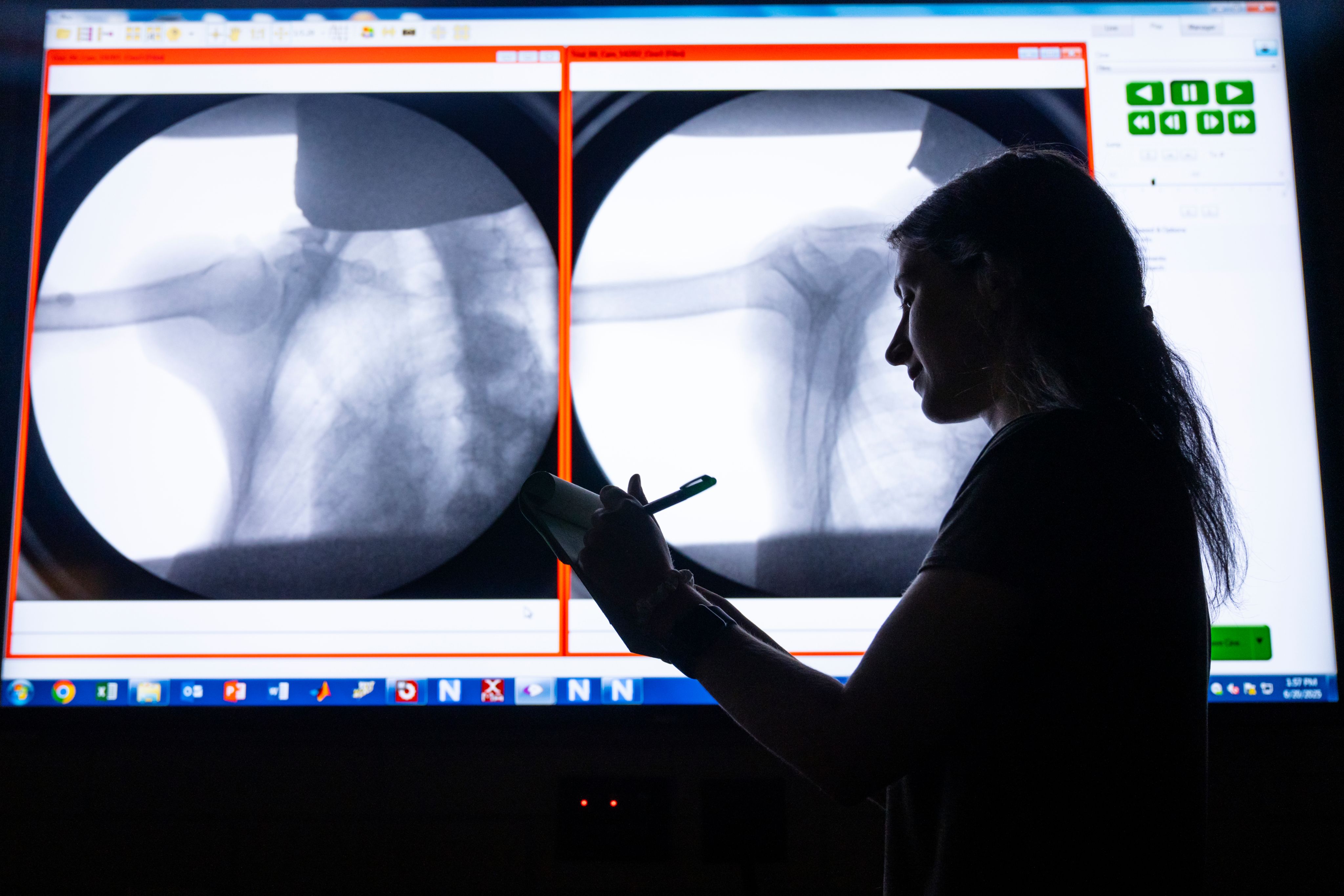A researcher standing in front of X-Rays