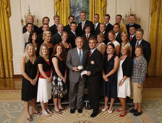 The 2008 DU ski team with President Bush pose for a picture in a government building 
