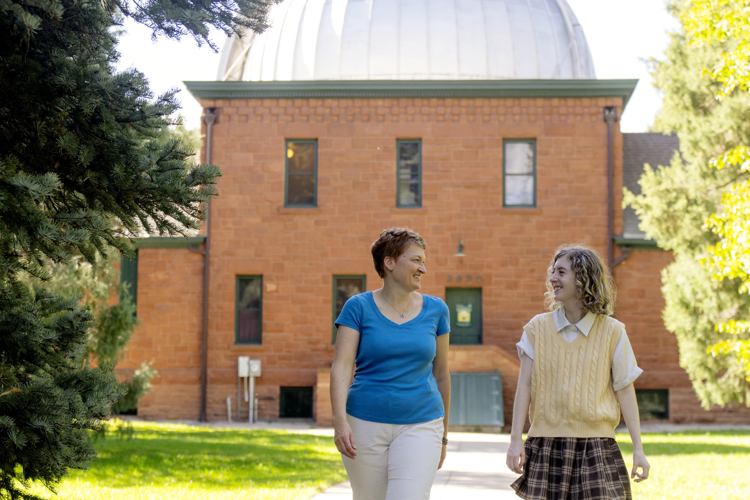 At home in the Chamberlin Observatory, physics major Mia Burgener (left) and Professor Jennifer Hoffman share a passion for binary stars.