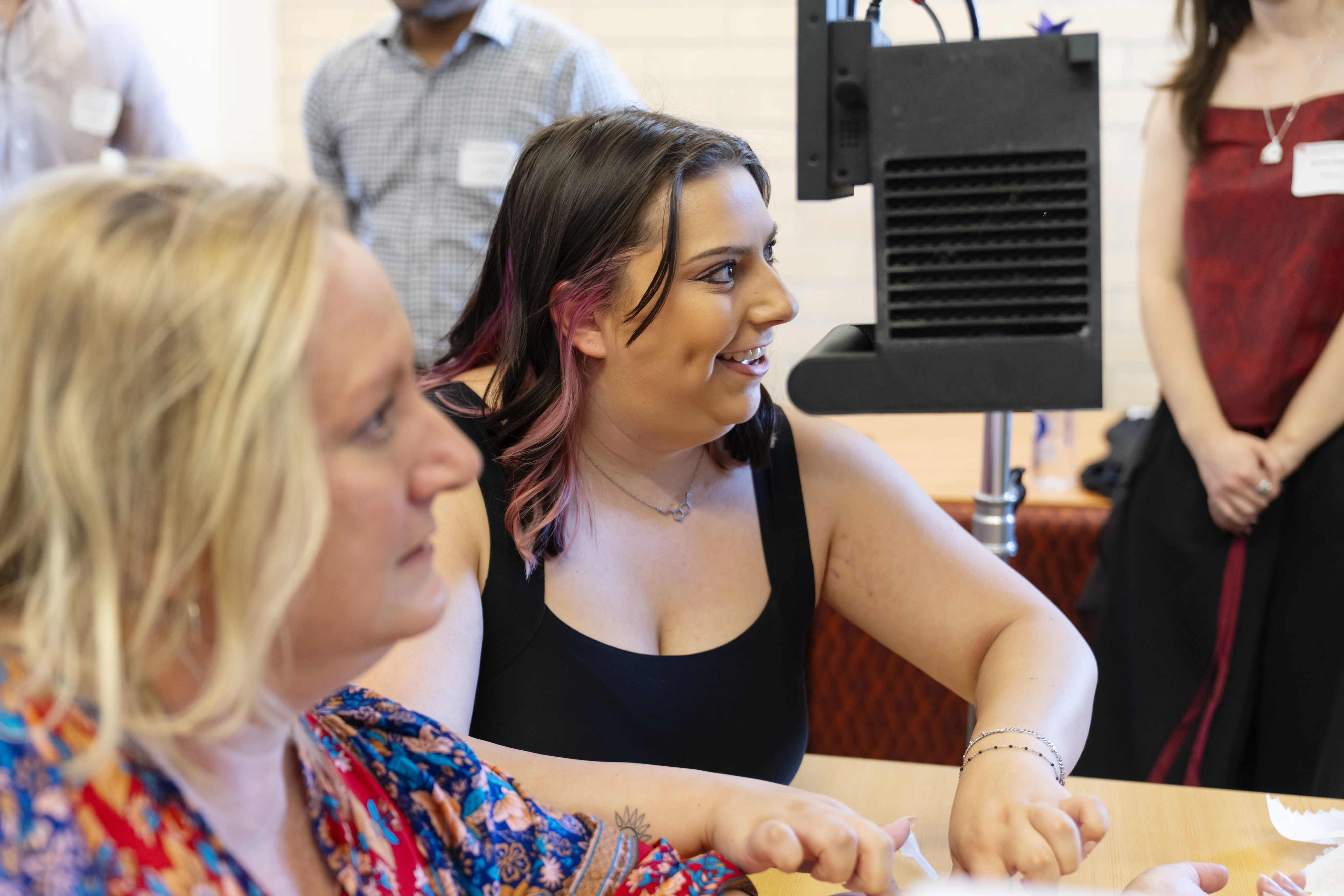 Senior Riley Alcala demonstrates the vein visualization device.