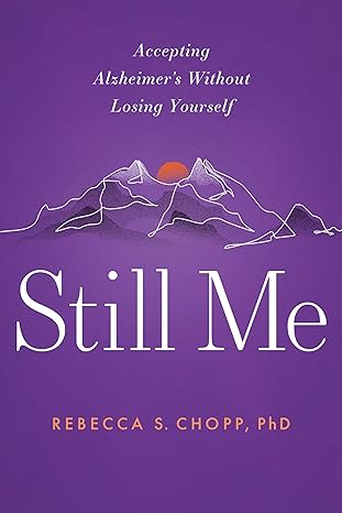 Still Me cover with an orange sun setting behind white wireframe mountains on a purple background.