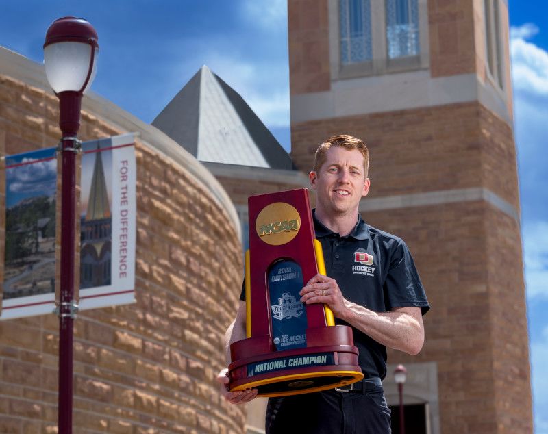 David Carle with NCAA championship trophy