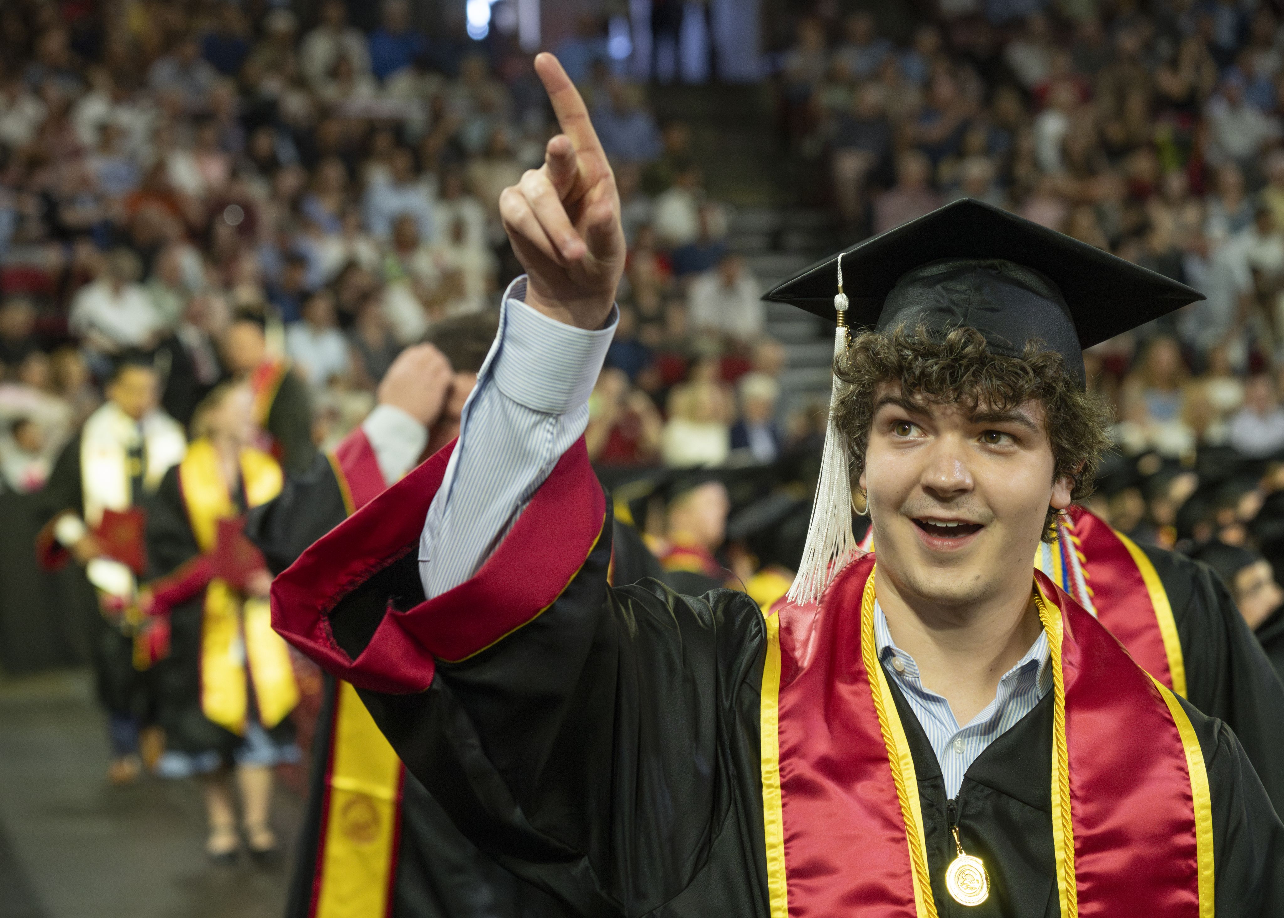 An undergraduate student at commencement