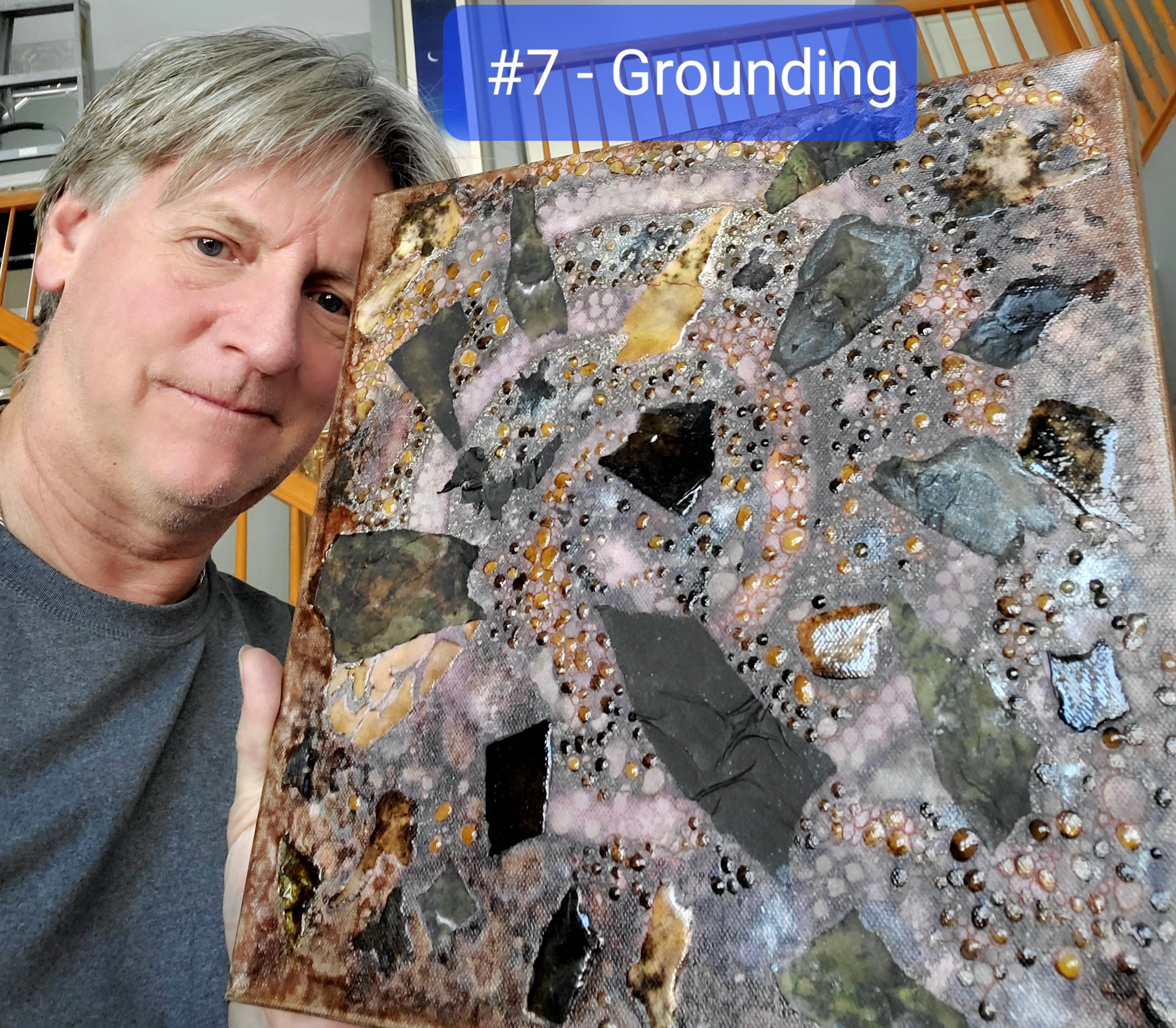 Mark Steinhauser holding a piece of art