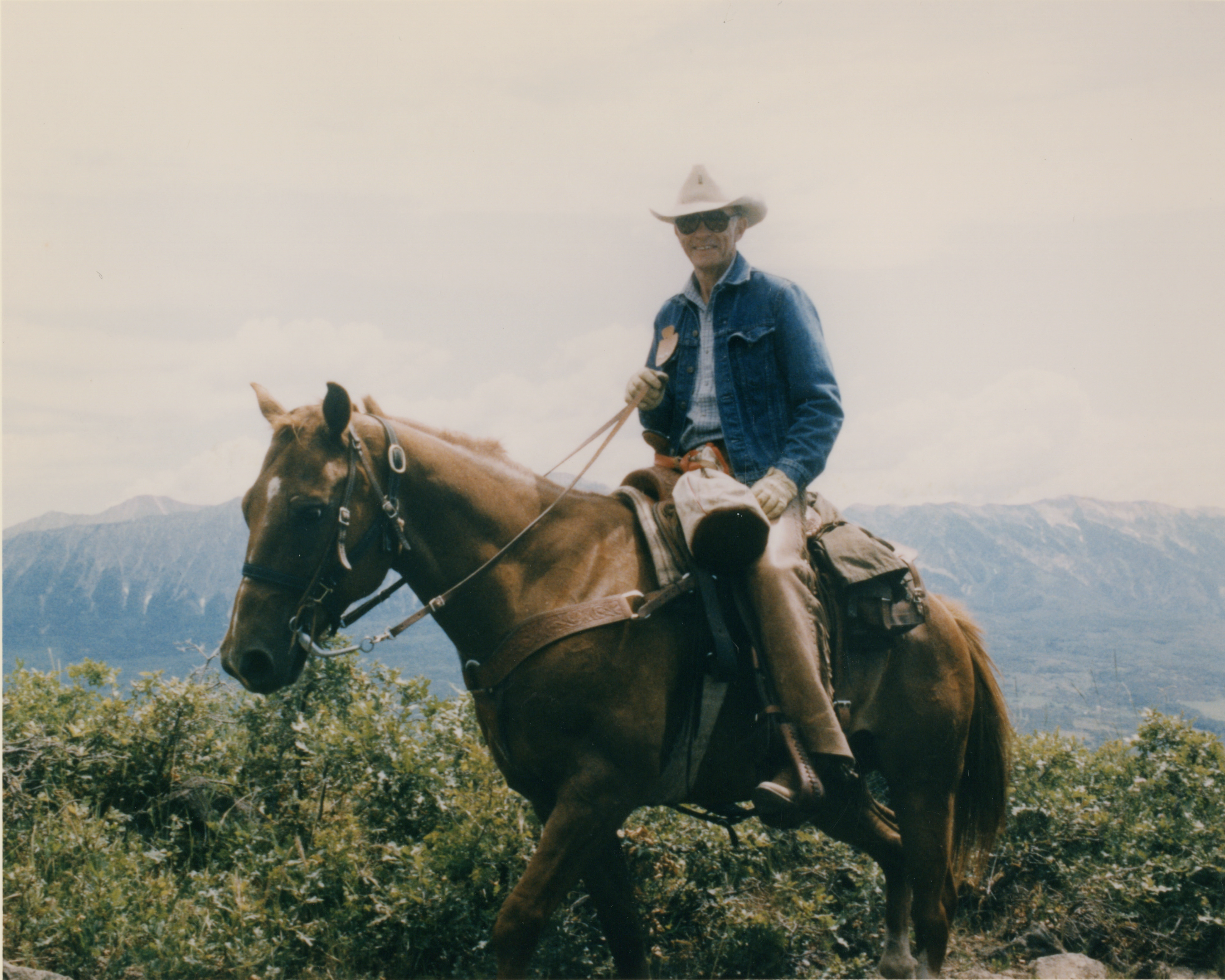 Dan Ritchie on a horse, wearing a cowboy hat.