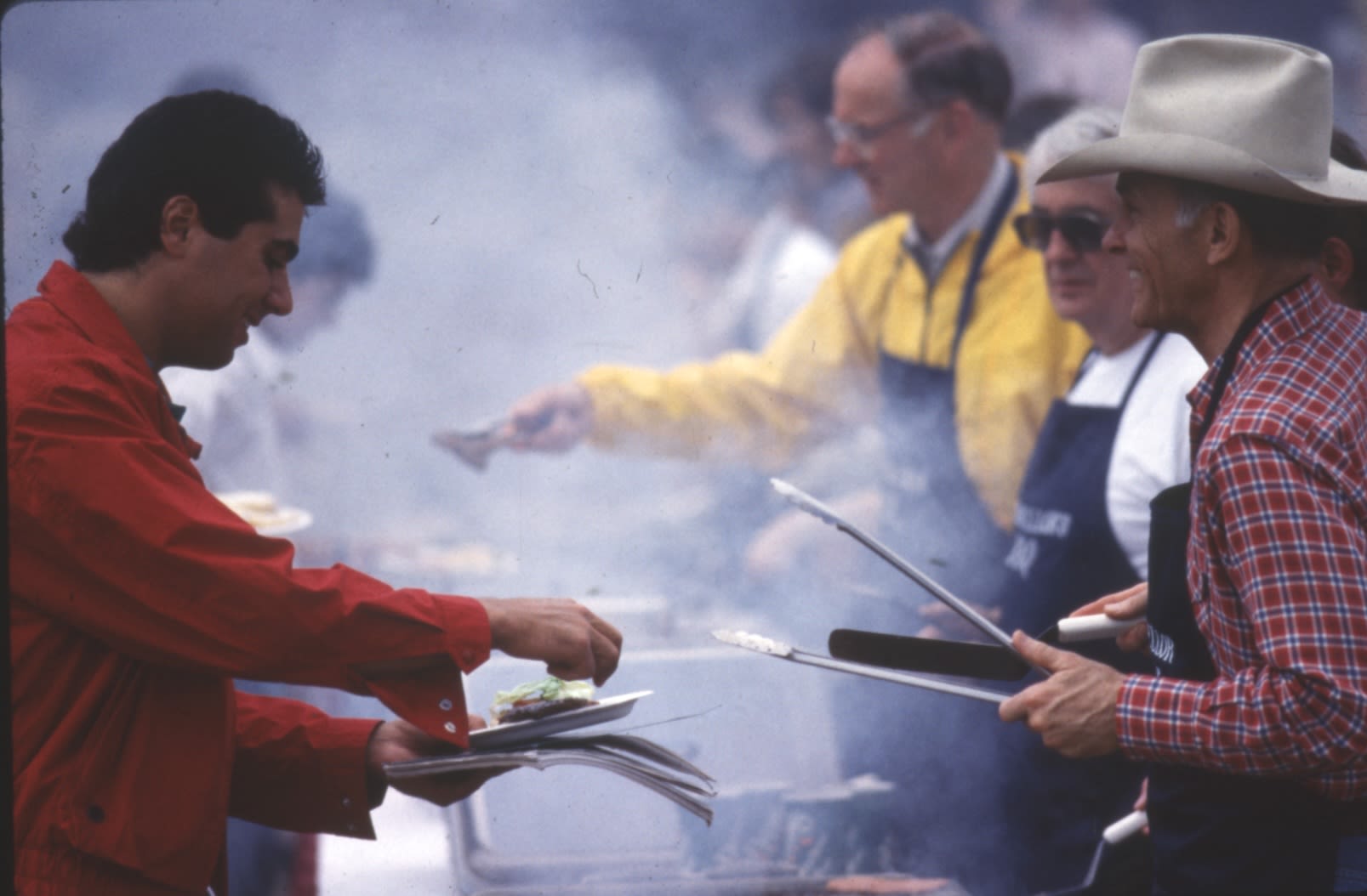 Dan Ritchie wearing a cowboy hat at a cookout
